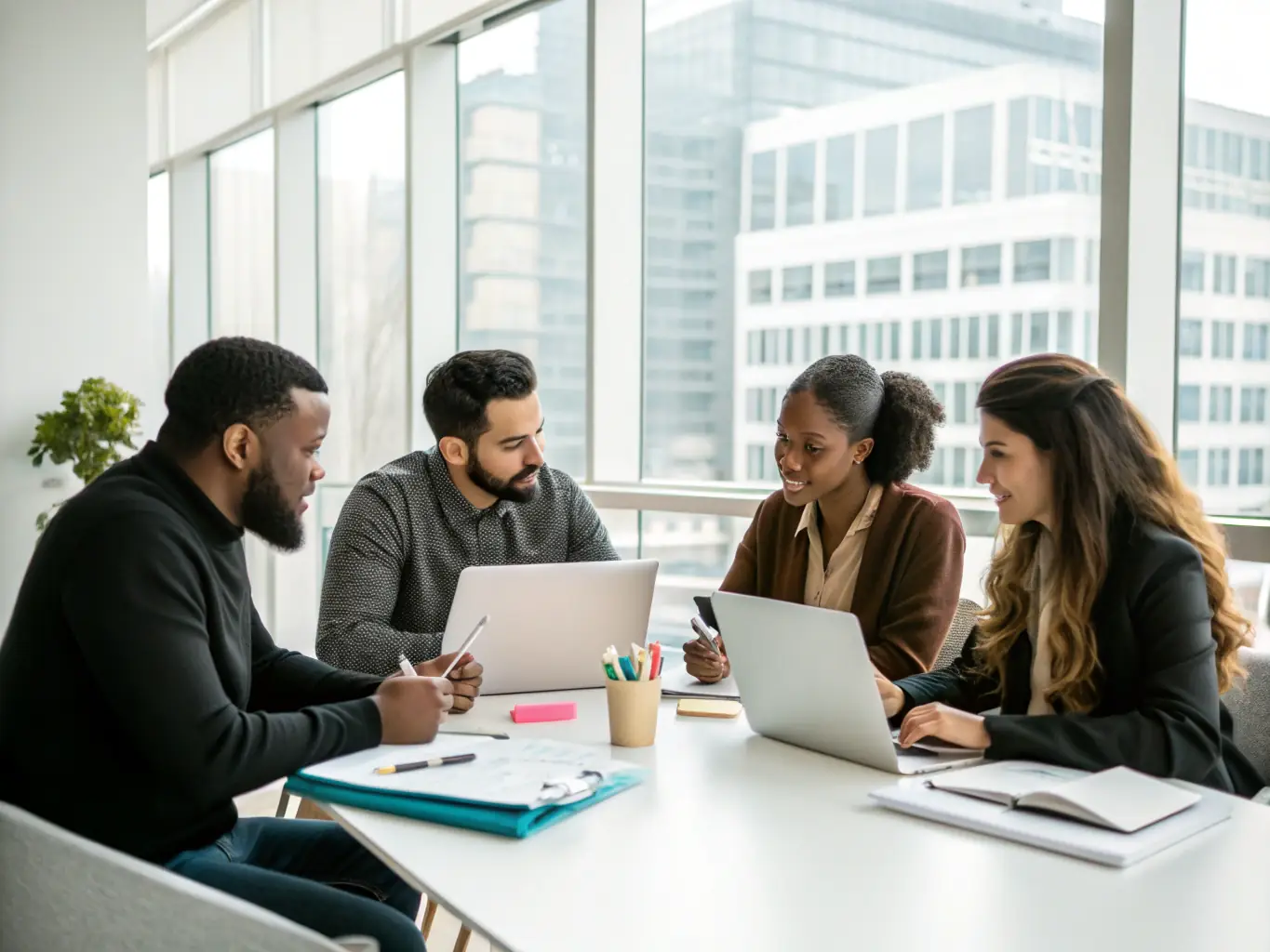 An image showing a diverse team of professionals collaborating in an office environment, symbolizing staffing and onboarding.